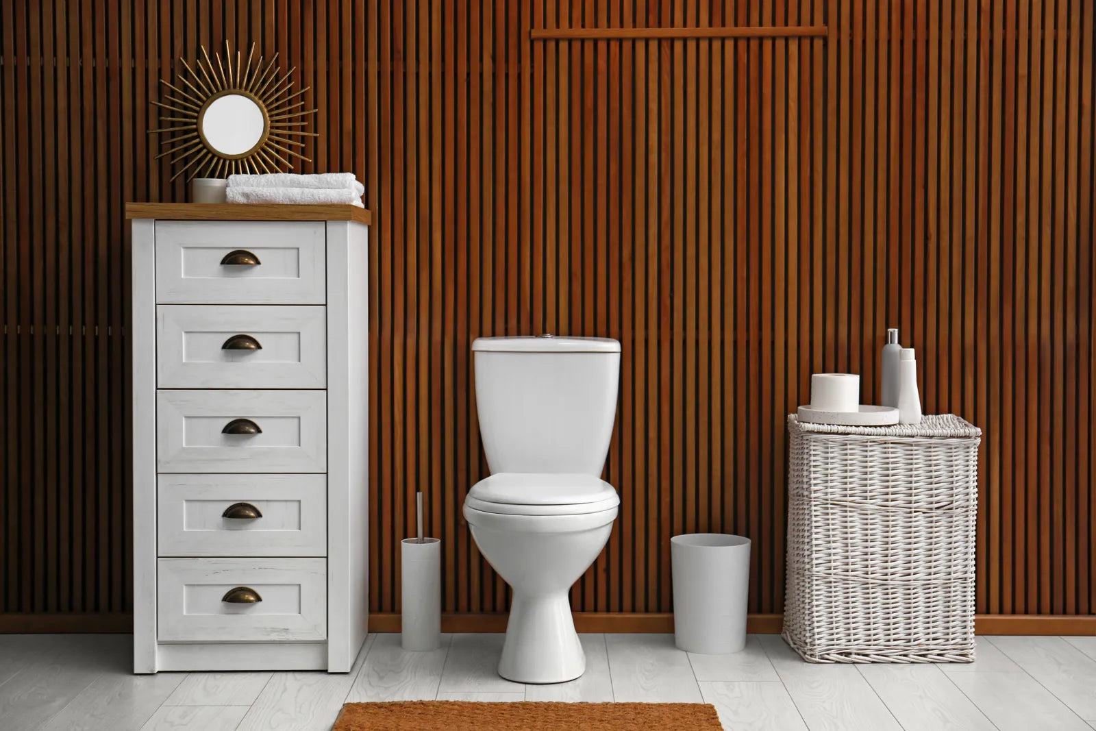 Modern bathroom with a standard toilet, highlighting the typical space requirements.