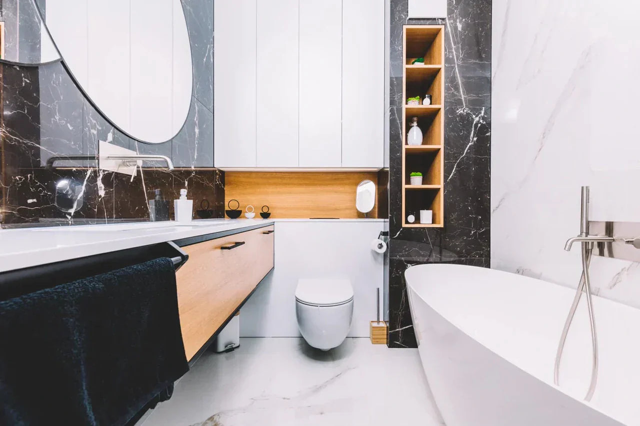 Wall-mounted smart toilet in a modern bathroom with storage and a sleek bathtub for daily comfort.