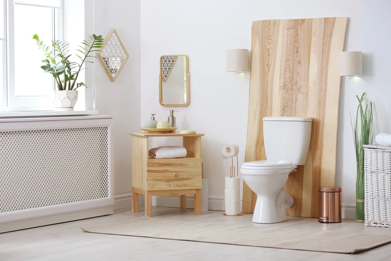 White two-piece toilet in a warm minimalist bathroom setting designed for everyday residential comfort and practical storage.