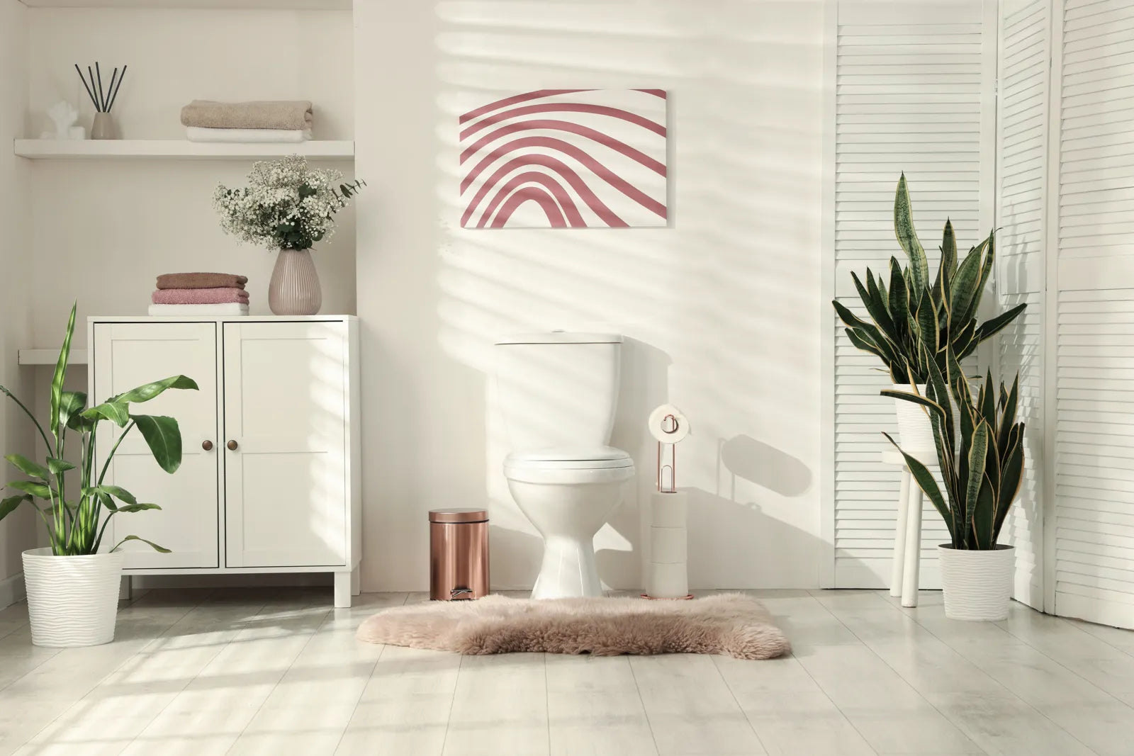 Clean modern bathroom with a standard toilet, highlighting the setting for bidet hygiene discussions.
