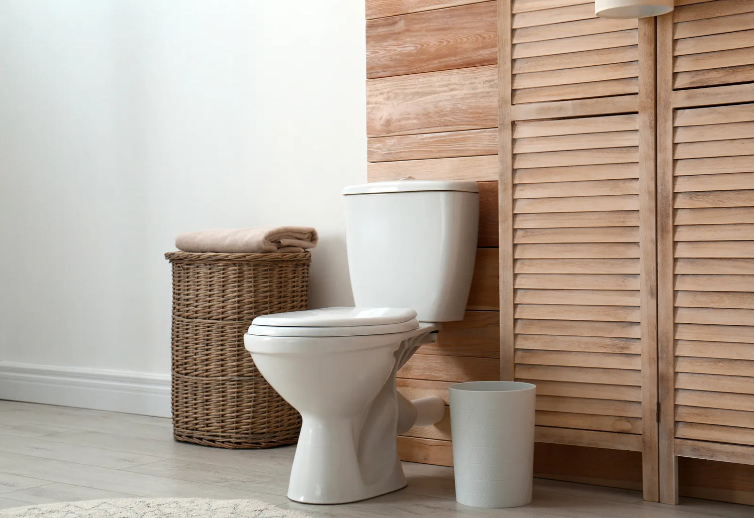 A clean, affordable bidet toilet sits in a bright, modern bathroom space.