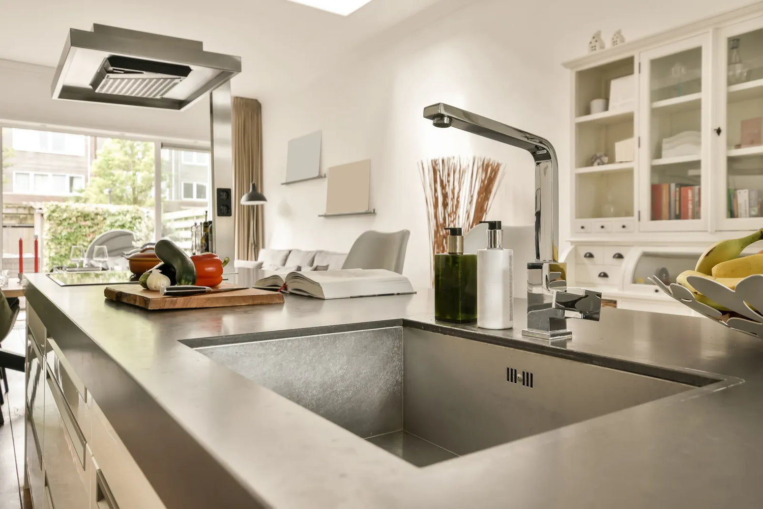 Sleek stainless steel undermount sink in an open-concept kitchen, offering a seamless, modern look.