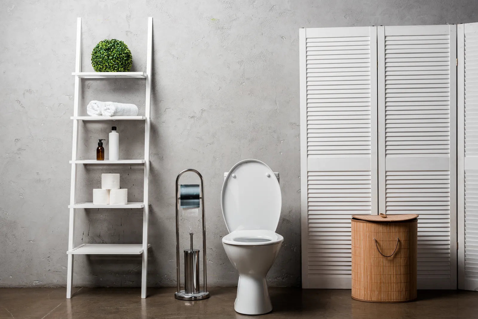 A minimalist bathroom displays a standard toilet, where foam shield tech enhances hygiene.