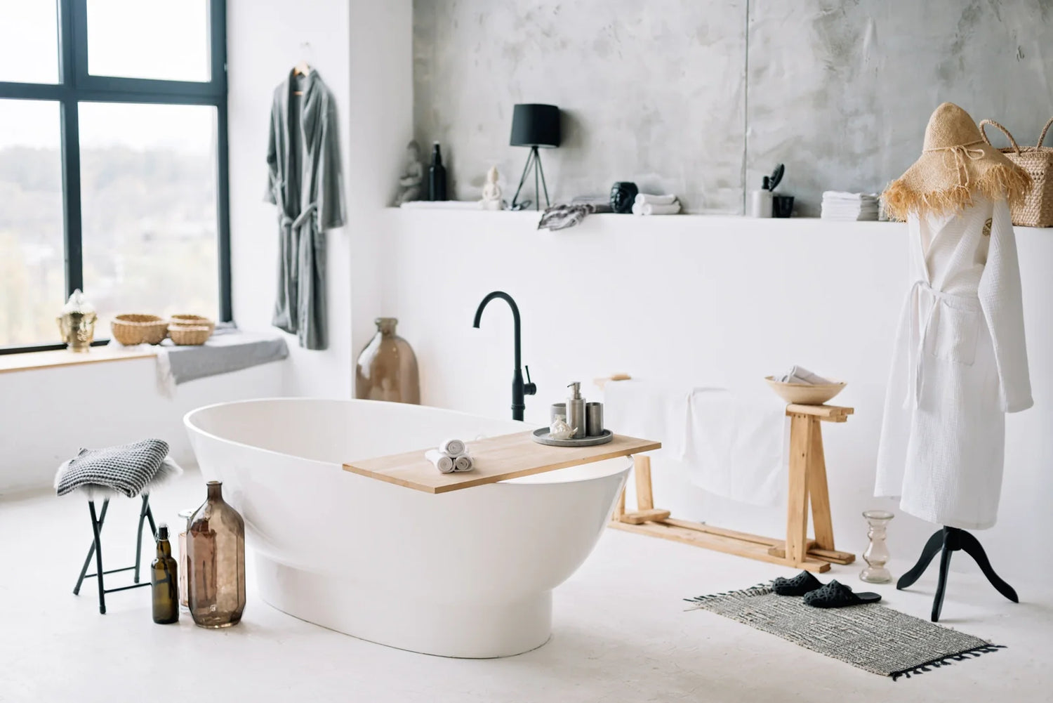 A stylish bathroom with a freestanding bathtub and minimalist decor.