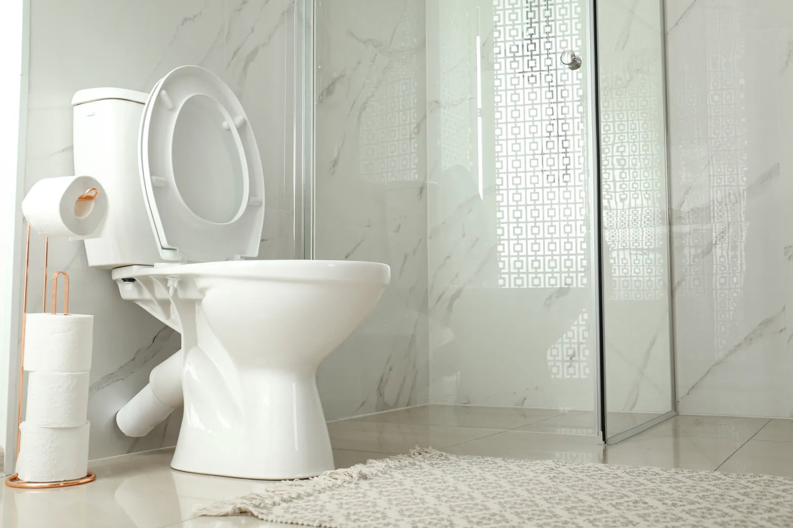 Troubleshooting Weak Flushing Toilets in Your Home – See a clean, modern bathroom toilet like the one you use every day.