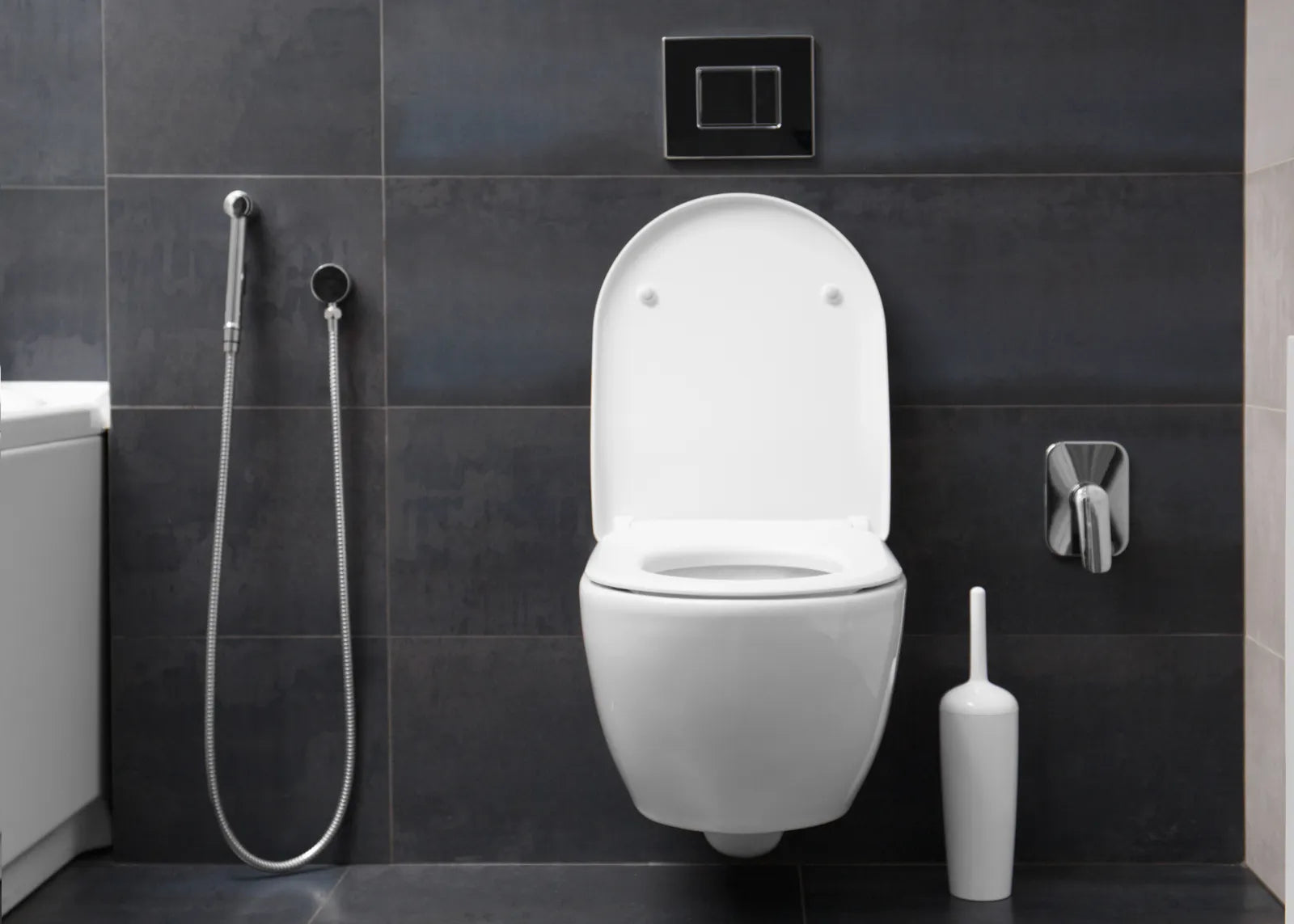 A wall-mounted smart toilet sits in a bathroom for power use evaluation.