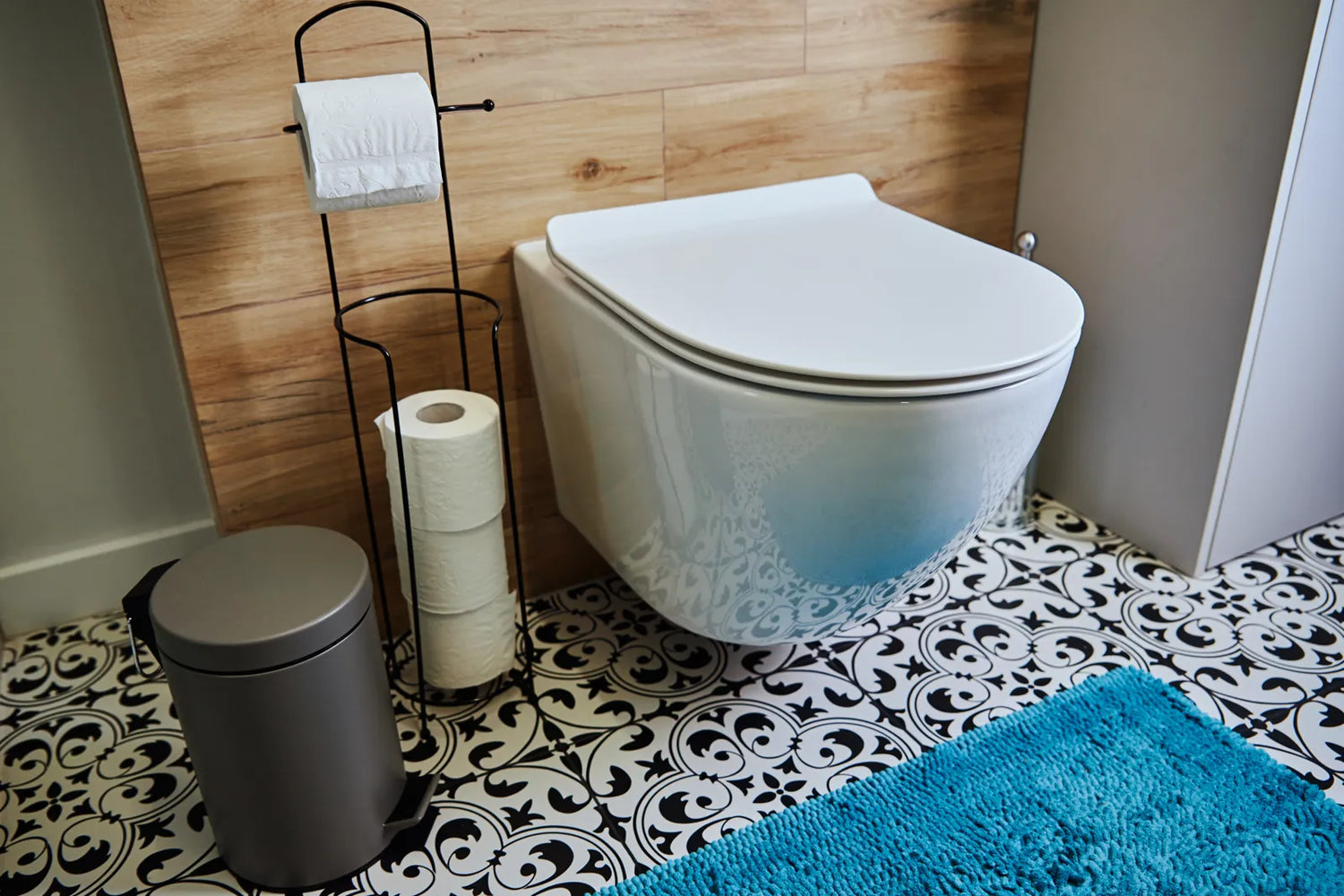 Stylish wall-hung smart toilet in a contemporary bathroom, built with a tested weight limit to support heavy use and durability.