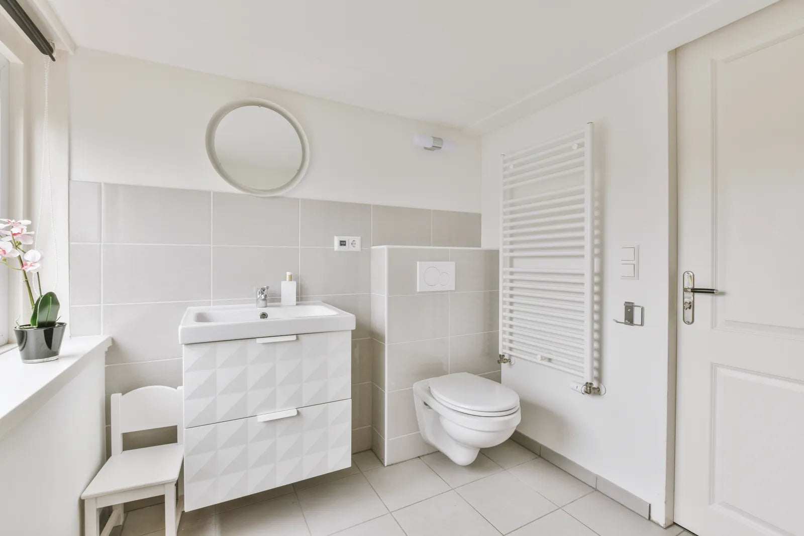 A modern bathroom setup shows a bidet toilet for water flow troubleshooting.