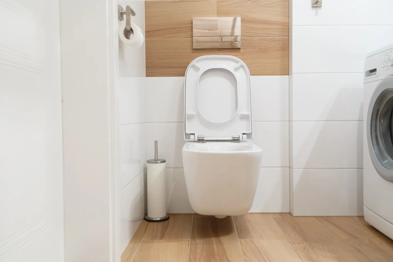 Completed wall-hung toilet in a modern bathroom, showcasing the final setup that meets all plumbing needs.