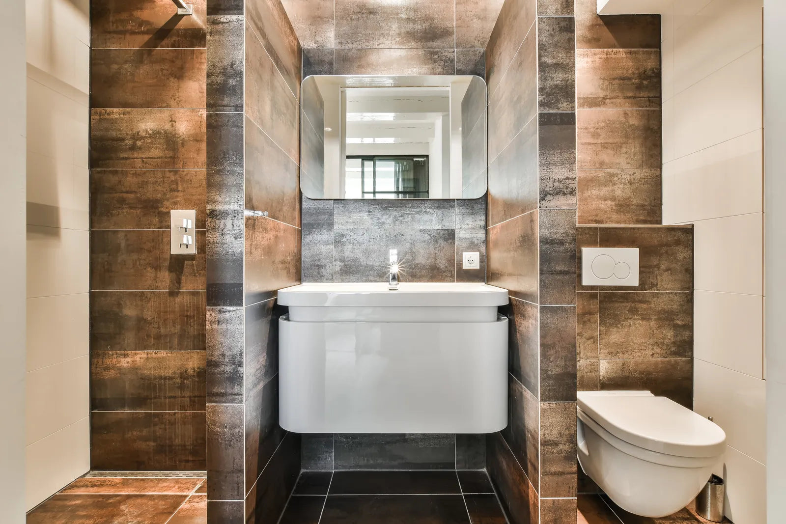 A sleek wall mount bathroom sink complements a modern bathroom design.