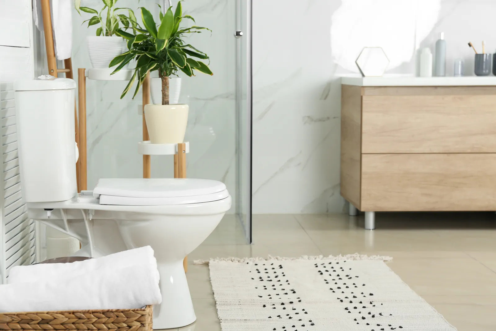 Bright, minimalist bathroom with a WaterSense-certified toilet, showcasing eco-friendly bathroom design and water efficiency.