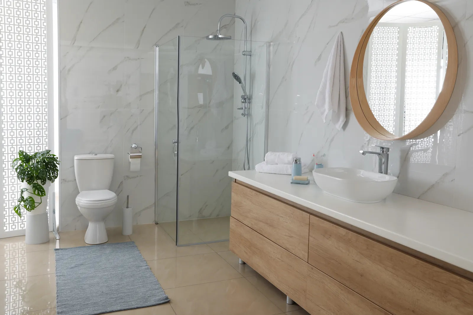 Bright contemporary bathroom with a toilet, ideal for installing a smart toilet with automatic open and close lid features.