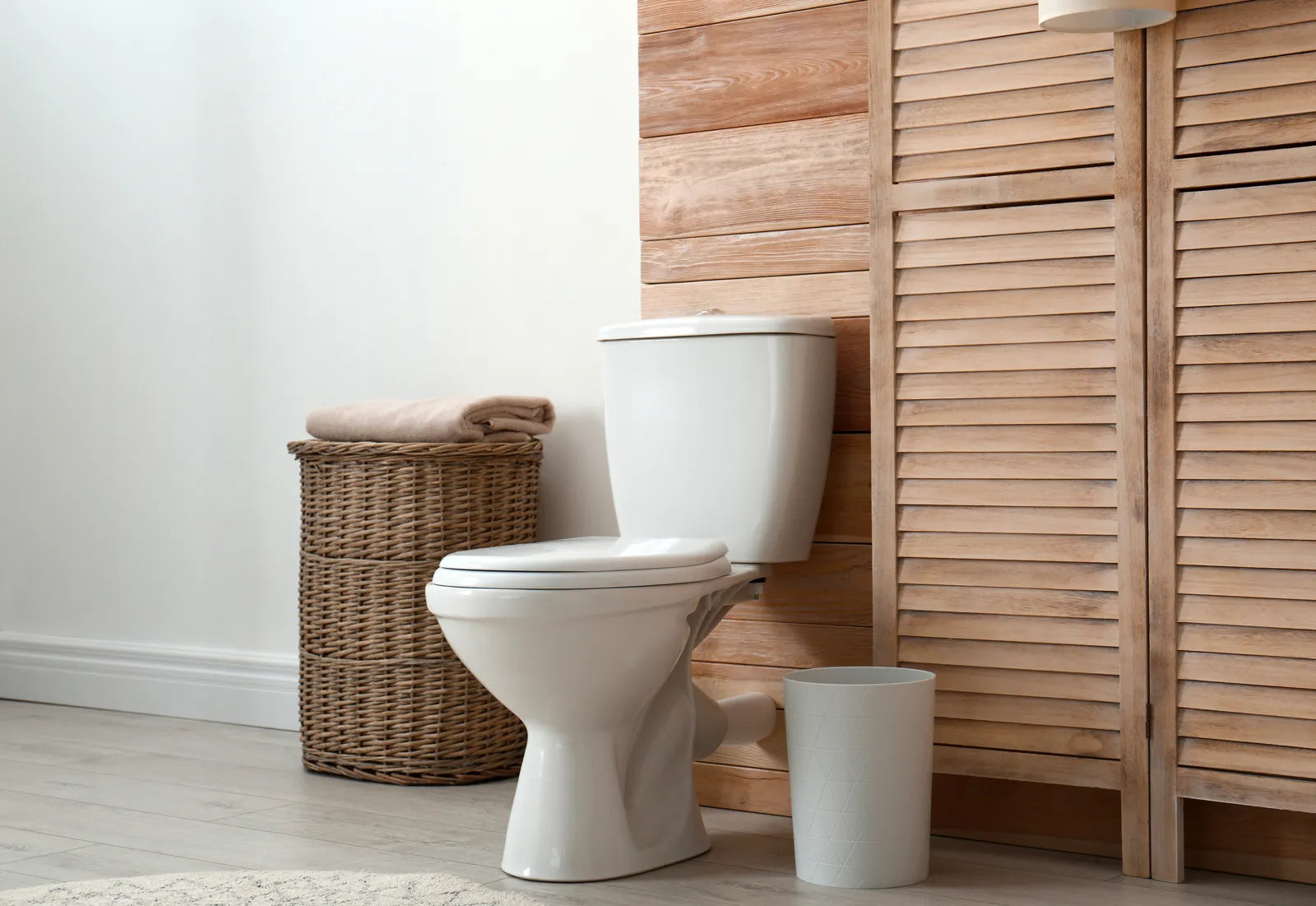 A clean, affordable bidet toilet sits in a bright, modern bathroom space.