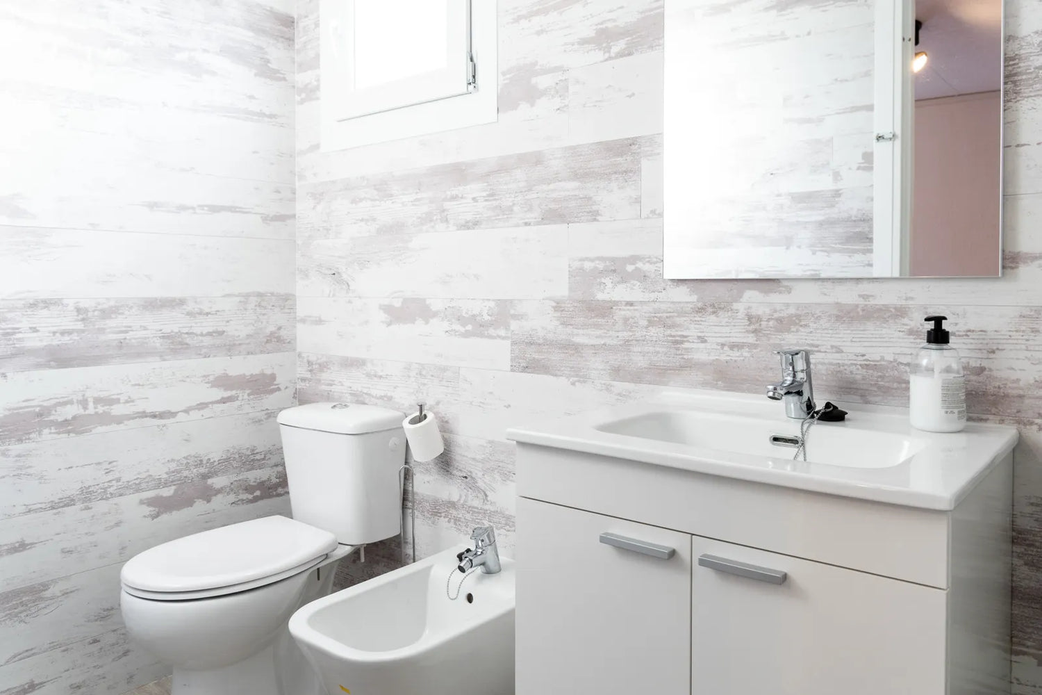 Senior-friendly bathroom with temperature-controlled bidet and valve systems for safe water control and enhanced hygiene.