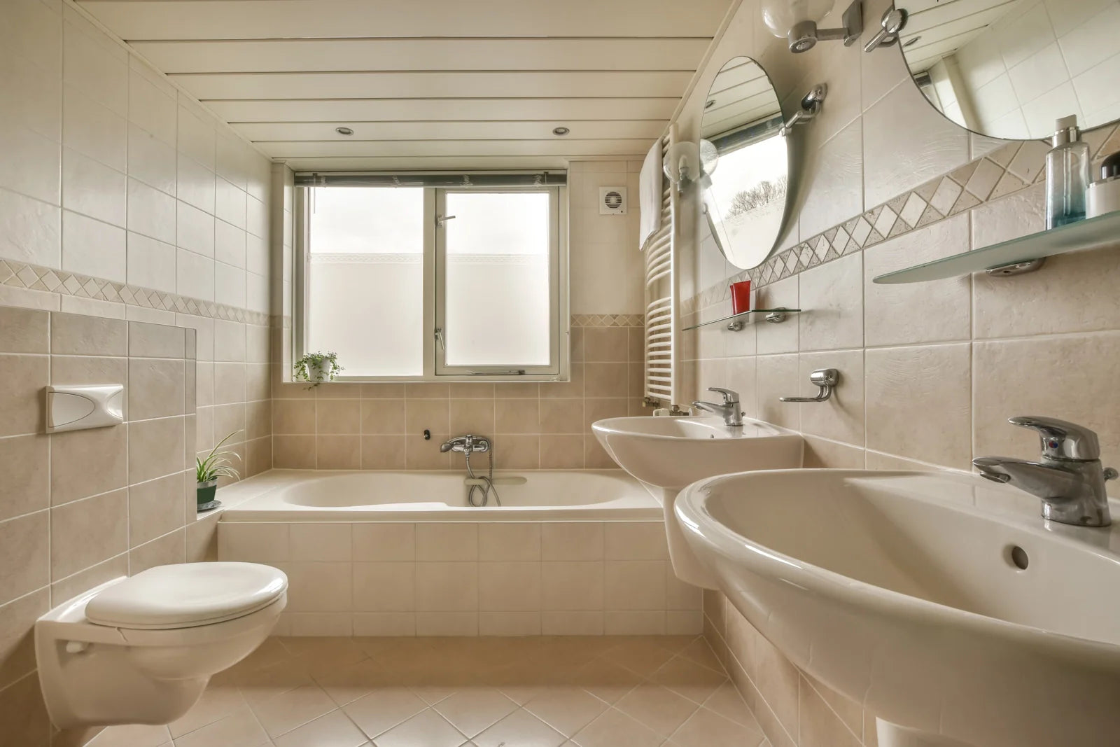 A typical household bathroom with a standard toilet, often compared to smart bidet toilet systems.
