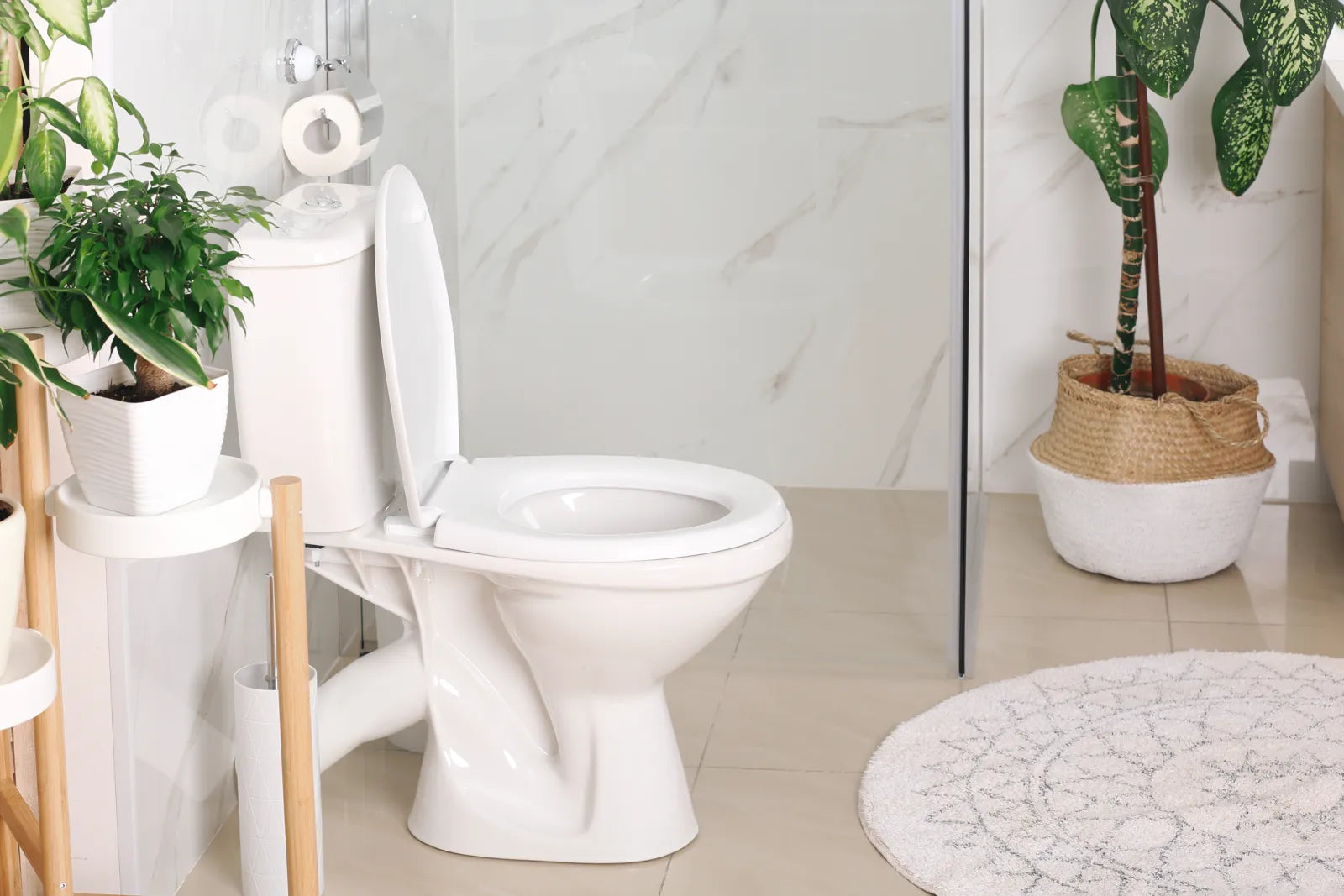 New dual flush toilet installed in a bright bathroom, highlighting the sleek look of this water-efficient fixture.