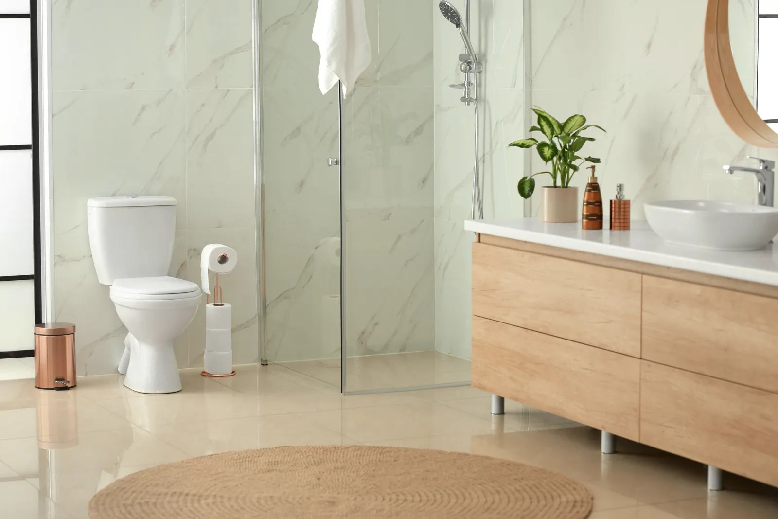 Modern bathroom with a glossy white toilet, highlighting the clean, bright aesthetic of white toilets in contemporary spaces.
