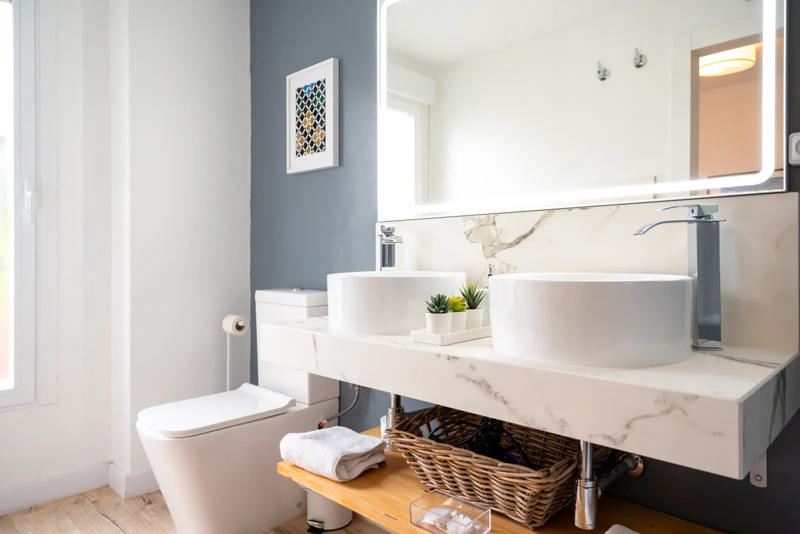 Modern bathroom with a smart toilet, highlighting the need for a reliable power source.