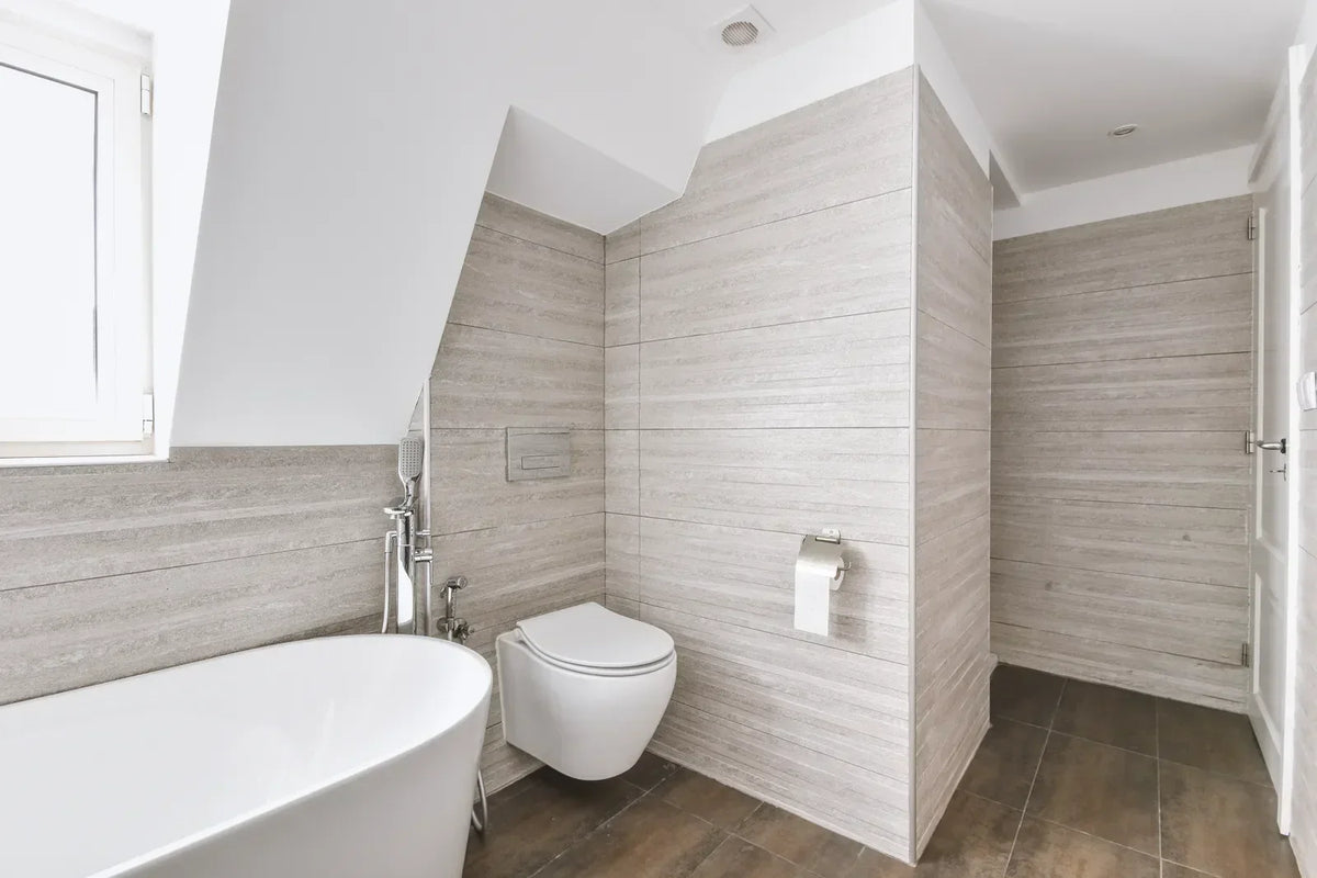A modern bathroom features a deep soaking tub that eases sore muscles with warm, immersive hydrotherapy.