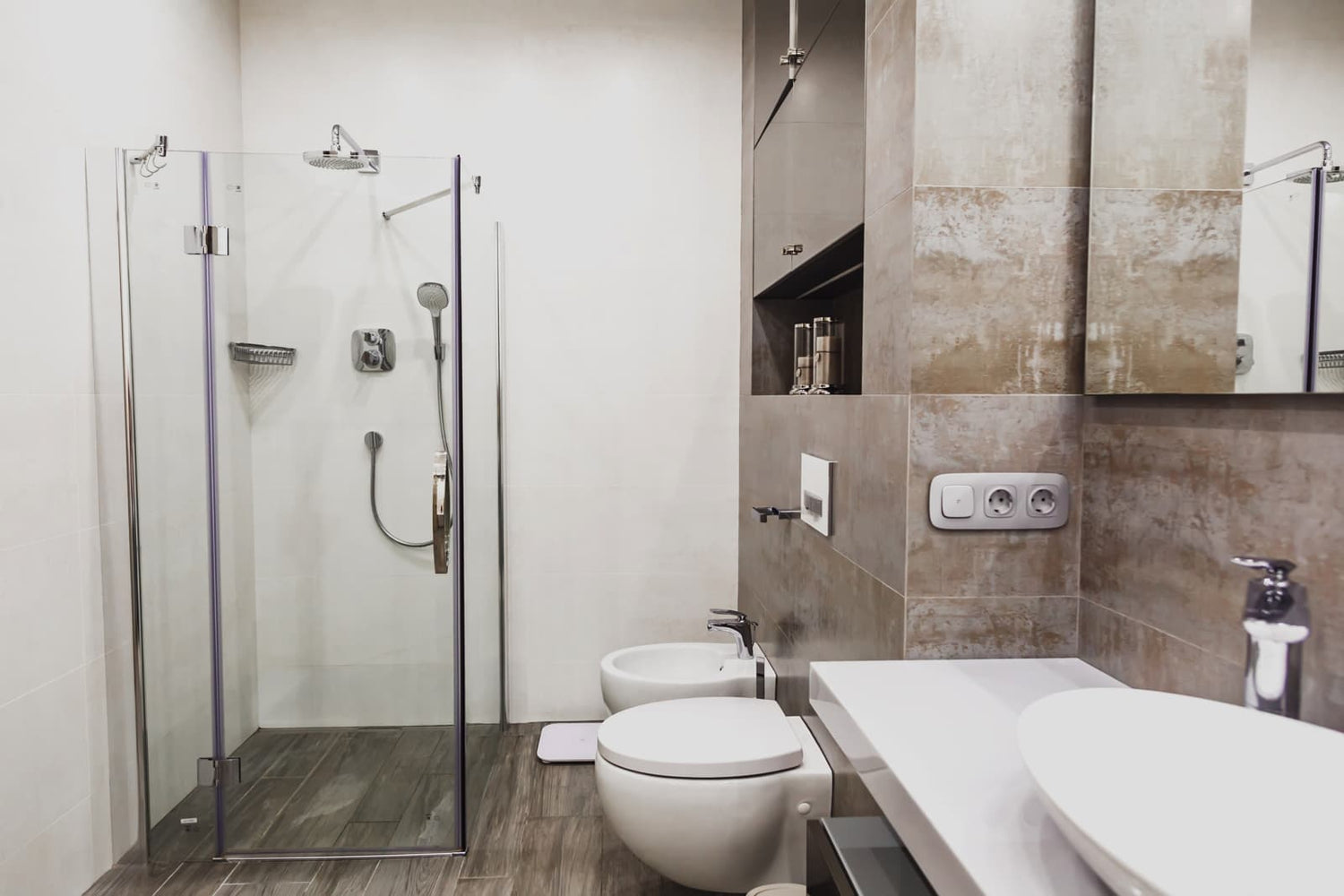 Contemporary family bathroom fitted with a sleek hinged glass shower door equipped with soft close hinge hardware.